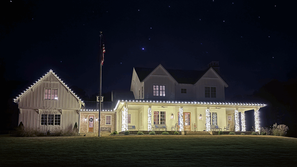 House with Christmas lights shining at nighttime- Landscaping and Pressure Washing in Bethlehem GA